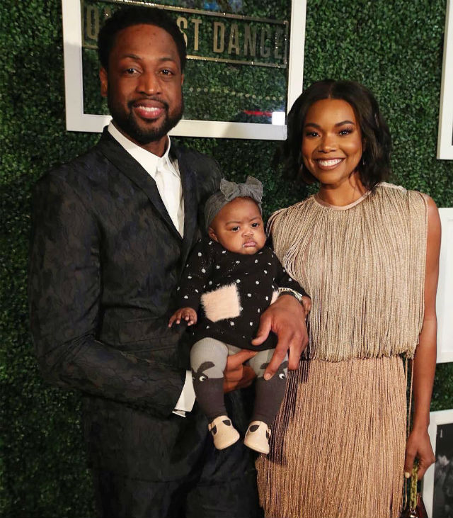 Dwyane Wade, Gabrielle Union, and Kaavia at Miami Heat Game